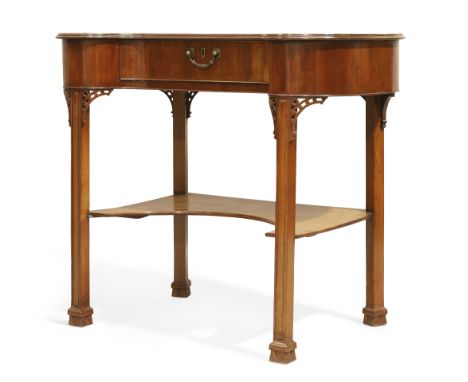 An English mahogany kidney shape writing table,&nbsp;Of George III style, last quarter 19th century,&nbsp;The tooled leather 