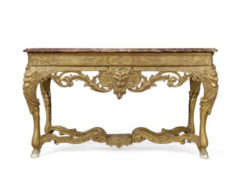 A Regence giltwood console table,First quarter 18th century, The marble top above carved frieze centred by a mask, on legs wi