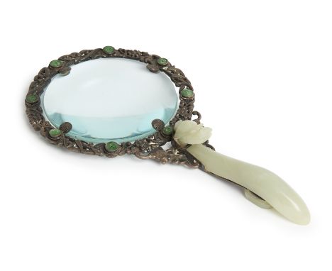 A Chinese magnifying glass with jade dragon belt hook handle and silver jade-inset rim,Late Qing dynasty / Republic,The jade 