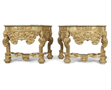 A pair of Dutch giltwood console tables,  In the Manner of Daniel Marot, first quarter 18th century,  Each with male caryatid