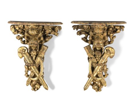 A pair of Louis XIV giltwood console tables,Last quarter 17th century, With shaped breccia marble tops above finely carved mi