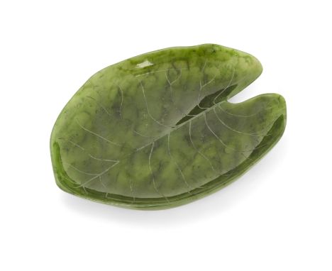 A Chinese spinach jade leaf form dish,  20th century, Carved as a lily pad, 20cm longCondition Report:  Light wear, generally