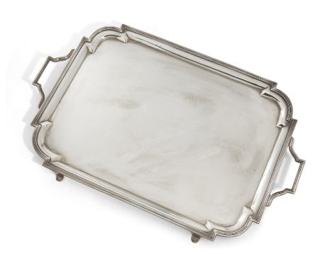 An Art Deco silver twin-handled tray, London, 1936, Carrington &amp; Co.,Of shaped rectangular form, the angular handles to s