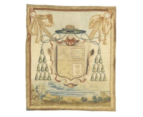 A Flemish armorial tapestry, Possibly Brussels, 17th century,Woven in wools and silks with the coat of arms of an archbishop 