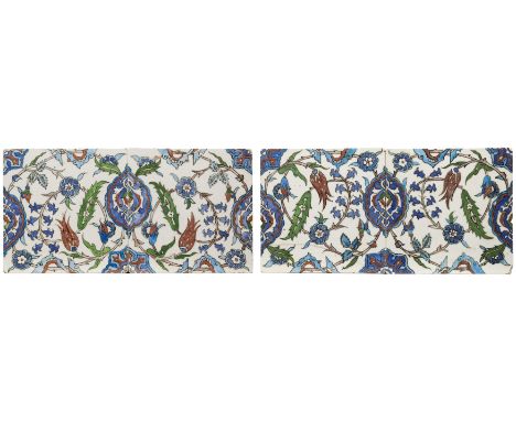 An Iznik-style polychrome pottery tile panel,  Kutahya, Turkey or Europe, 20th century, Mounted in pairs, a simplified flower