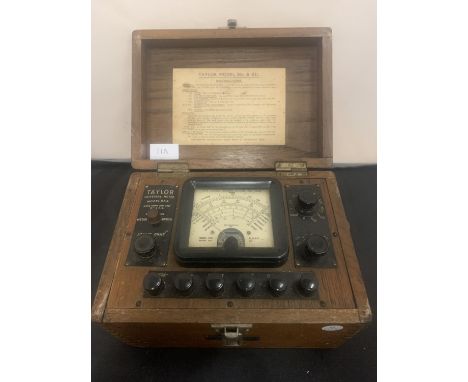 A BOXED VINTAGE TAYLOR UNIVERSAL METER MODEL 83A TO INCLUDE INSTRUCTIONS AND AN INTEGRATED COMPARTMENT 