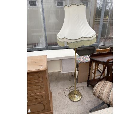 A MODERN BRASS STANDARD LAMP COMPLETE WITH SHADE 