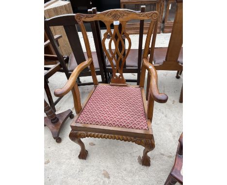 A MAHOGANY CHIPPENDALE STYLE ELBOW CHAIR ON CABRIOLE LEGS, WITH BALL AND CLAW FEET 
