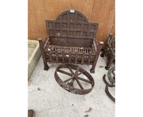 A VINTAGE FIRE GRATE TO INCLUDE A VINTAGE CAST WHEEL 