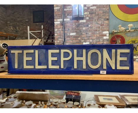 AN ILLUMINATED LIGHT BOX 'TELEPHONE' SIGN 