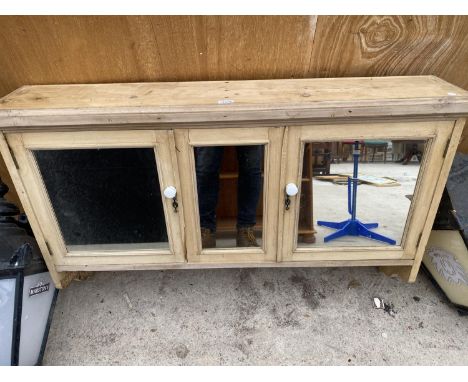 A VINTAGE PINE MIRRORED WALL UNIT 