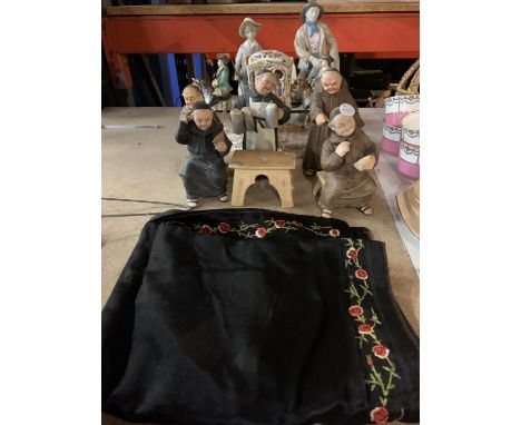 A VARIETY OF CERAMIC FIGURINES AND A PIECE OF EMBROIDERY 