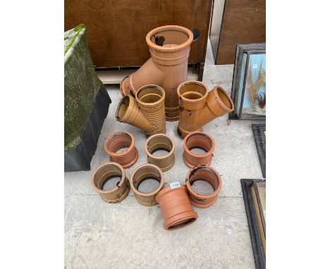 AN ASSORTMENT OF DRAINAGE PIPE FITTINGS 