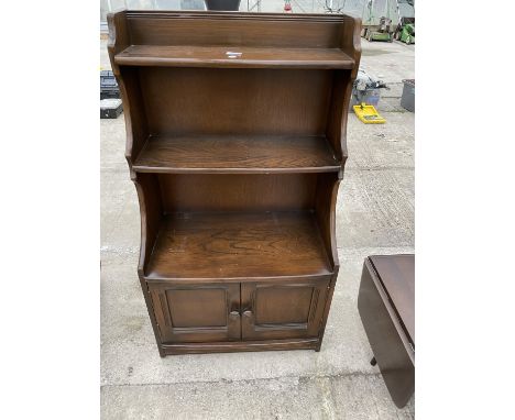 AN ERCOL WATERFALL BOOKCASE 