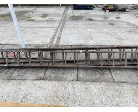 A WOODEN TWO SECTION LADDER 