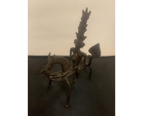 A VINTAGE CAST ORNAMENT IN THE ABSTRACT FORM OF A SOUTH AMERICAN STYLE HORSE AND RIDER 