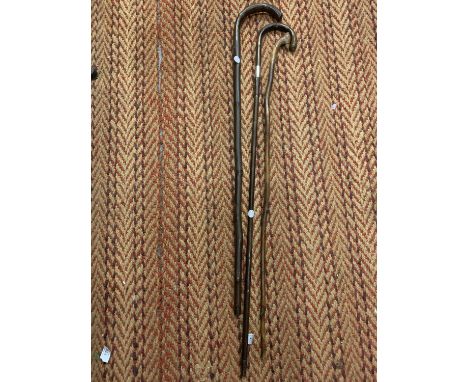 A 1925 SILVER MOUNTED PARTRIDGE WOOD WALKING STICK AND TWO FURTHER EXAMPLES 
