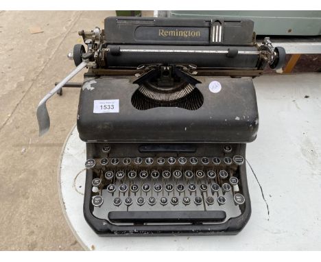 A VINTAGE REMINGTON TYPE WRITER 