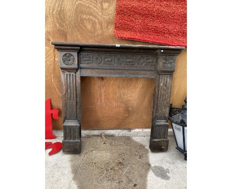 A VINTAGE WOODEN FIRE SURROUND 