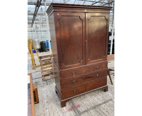A VICTORIAN MAHOGANY LINEN PRESS ON BRACKET FEET  WITH TWO SHORT AND TWO LONG DRAWERS, TWO UPPER DOORS AND THREE INNER LINEN 