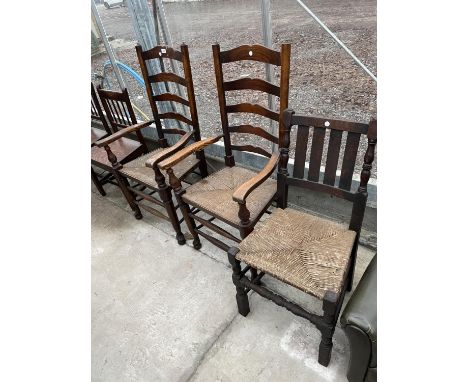 A PAIR OF LANCASHIRE STYLE LADDER BACK ELBOW CHAIRS, (ORIGINAL RETAILER LABEL JOHN BLOWER, SHREWSBURY) AND SINGLE DINING CHAI
