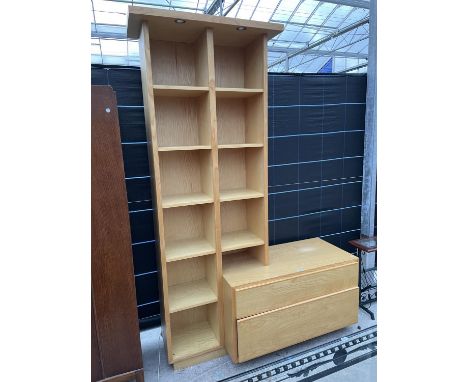 A LIGHT OAK CHEST OF TWO DRAWERS WITH TEN OPEN DISPLAY SHELVES ABOVE - IN BUILT LIGHTING BELIEVED IN WORKING ORDER 