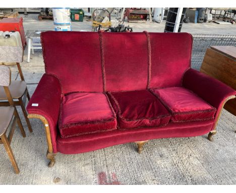 A MAHOGANY FRAMED THREE SEATER SOFA ON CABRIOLE SUPPORTS WITH RED VELVET STYLE UPHOLSTERY 