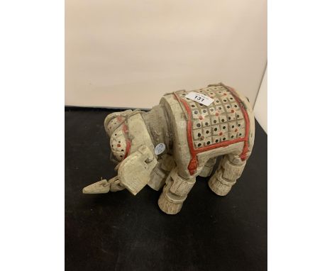 A WOODEN CARVED ELEPHANT PUPPET 