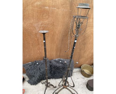 A VINTAGE OIL LAMP AND A LARGE VINTAGE CANDLE HOLDER 