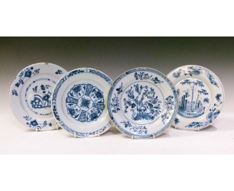 Mid-18th Century English delftware plate, painted with sunflower and bamboo in a garden and three other English delftware pla
