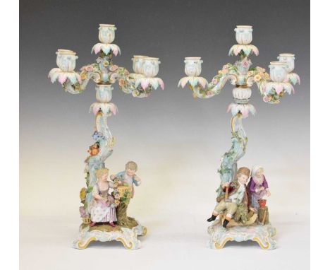 Pair of 19th Meissen floral encrusted figural four branch five light candelabra, with figures from the ‘Four Seasons’ series 