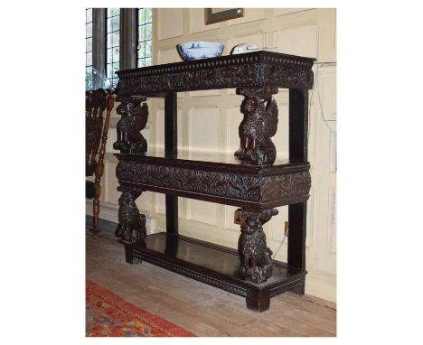 Charles I carved oak three-tier open ‘court cupboard’ or buffet, Home Counties, the moulded rectangular top with dentil mould