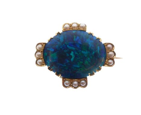 Black opal and seed pearl brooch, the oval opal approximately 15.5mm x 12.5mm x 3.3mm deep, with trios of seed pearls (untest