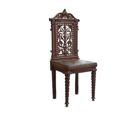 19th Century cast iron chair, the design attributed to Dr. Christopher Dresser for Coalbrookdale, cast with pierced scroll pe