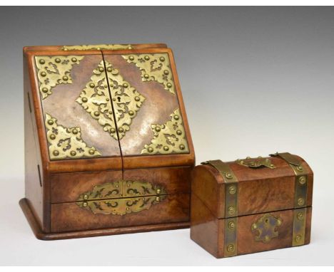 Late Victorian walnut and brass mounted stationery box, the hinged rectangular top over twin doors to the slope front enclosi