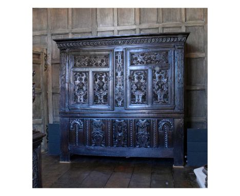 Impressive early 17th Century oak press cupboard, Flemish, circa 1600, the gadrooned frieze over a pair of triple-panelled do