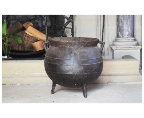 Coalbrookdale - 19th Century iron cauldron of seamed construction with angular lug handles and horizontal banding, vestiges o