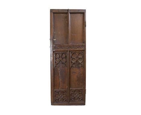 English early oak door, probably mid 16th Century, of four fielded panels, ogee arches and quatrefoils, with iron latch locki
