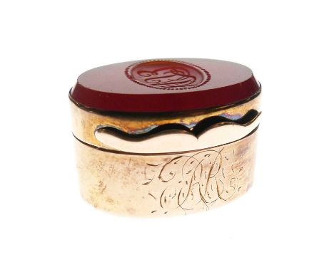 19th Century unmarked yellow metal and carnelian intaglio oval vinaigrette, the hinged cover engraved with cursive initials E
