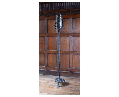 Iron standard lamp, in the 17th Century Spanish manner with curved arched candle shade, 186cm high