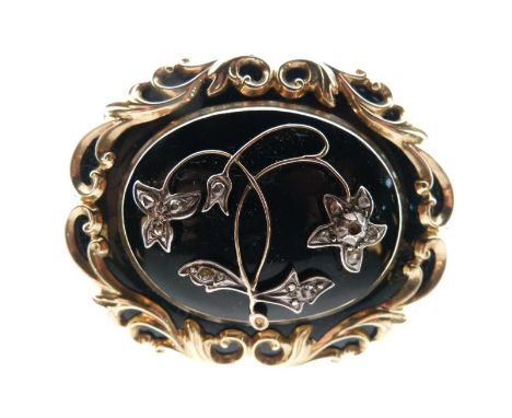 Victorian diamond and enamel mourning brooch, the rose diamond floral motif to a black enamel ground within a scroll frame, l