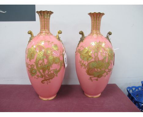 Royal Crown Derby Pair of Salmon Pink Porcelain Vases, of ovoid form, each with gilt handles, lute scrolling and foliage, num