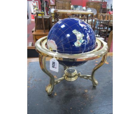 Mineral Terrestrial Globe, in brass stand having compass to unite three lower stretchers, approximately 31cm wide.