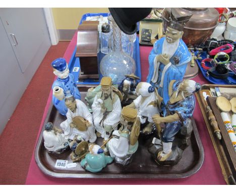 Twelve Pottery Chinese figures, the tallest 32cm, Dutch figural decanter:- One Tray.