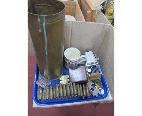 A Military Brass Shell Case, belt of cartridges, compass, pitch pipes, etc:- One Tray.