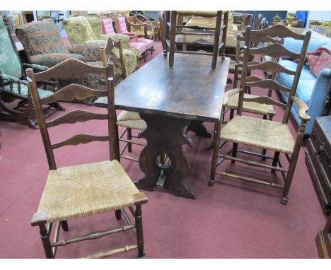 A XX Century Oak Refectory Table, with a rectangular top, trestle ends, centre rail, together with a set of six ash/elm ladde