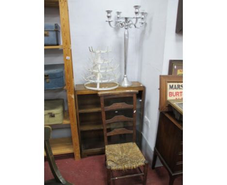 A Painted Metal Bottle/Glass Stand, on concentric circular form, 42cm high. Four branch table candelabra, ladder back chair. 