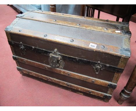 A Late XIX Century Domed Top Travelling Trunk, with wood slats, lock plate, twin handles.