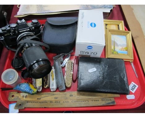 Olympus OM10 Camera, pen knives, sketch album, etc:- One Tray.