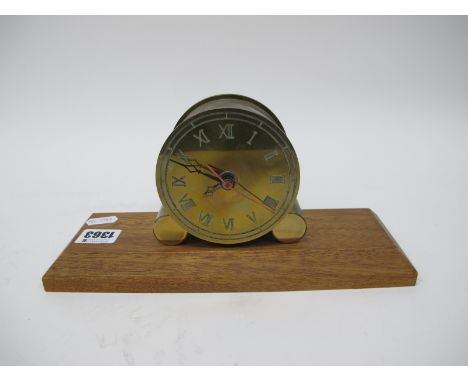 Brass Cylinder Cased Mantle Clock, with Arabic numerals to one side and Roman numerals to other, 9.5cm diameter, on stand.